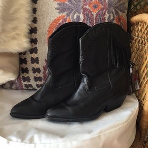 Black heeled booties with fringe